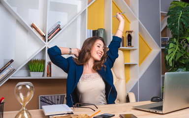 Concept: we return to work in the office, the end of quarantine. Successful business woman rejoices in return to office work