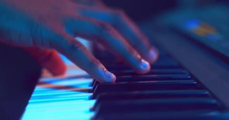 Close up of hands playing piano - Powered by Adobe