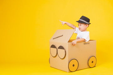 little children boy smile so happy driving car creative by cardboard