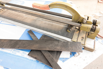 Cutting and grinding concrete or metal using a cut-off saw.