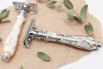 safety razor in the style of zero waste. Metal machine with epoxy handle