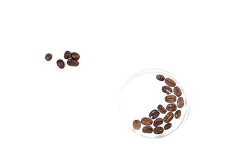 Coffee beans in a glass with milk and outside on a white background