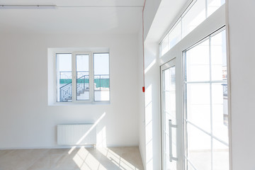 Fototapeta premium Office extension that uses bricks as a wall, construction, improvement. Interior of small room with window and bricks walls renovation, extension, overhaul and reconstruction.
