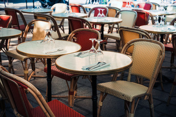 Street view of a coffee terrace with tables and chairs, Paris, France