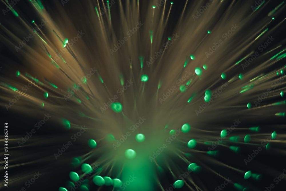 Poster Beautiful abstract green bokeh collapse background on a dark.