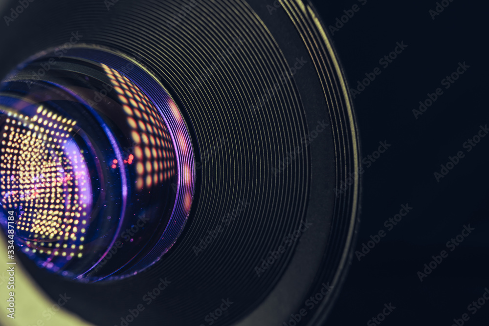 Poster close up beautiful camera lens on a black background. macro photography view..