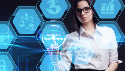 Business, Technology, Internet and network concept. Young businessman working on a virtual screen of the future and sees the inscription: Property management