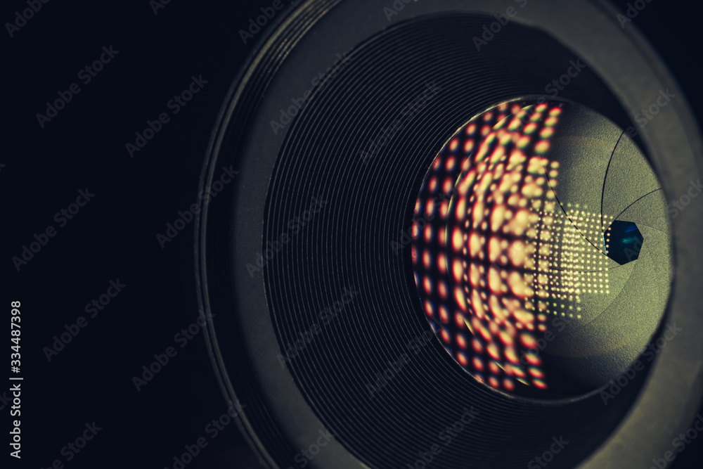 Poster close up beautiful camera lens on a black background. macro photography view..