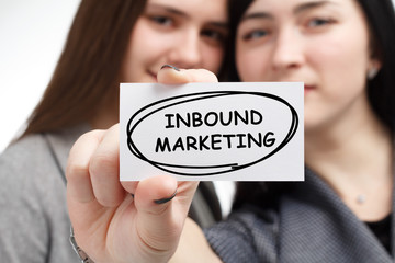 Business, technology, internet and network concept. Young businessman shows a keyword: Inbound marketing