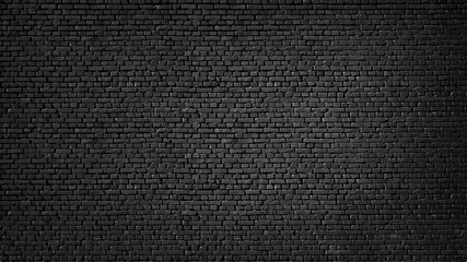 Texture of a black painted brick wall as a background or wallpaper - 334488748