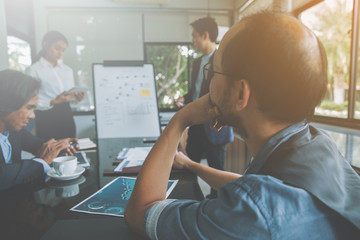 businessmen brainstorming for strategy of business investment,businessmen review chart and document