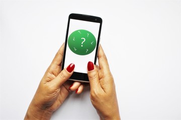 Woman hands holding smartphone looking question mark sign on screen. photo isolate on white top...