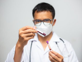 Fototapeta premium Doctor scientist show coronavirus (COVID-19) vaccine shot for virus infected patient's laboratory