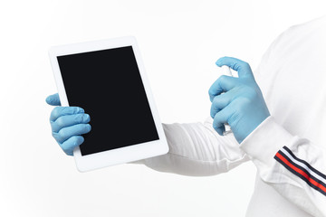 Cleaning. How coronavirus changed our lives. Man disinfecting gadgets on white background, close up. Prevention against pneumonia, keep on being on quarantine, stay home. Treatment COVID, recovering.