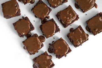 Delicious chocolate cakes with dripping chocolate on white tray