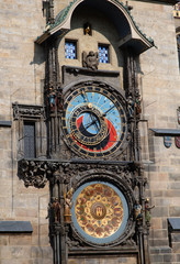 Vintage scene of Prague historical astronomic watch at city central square on Old Town Hall. Photo of colorful European city of Prague in Czech Republic daytime, travel in tourist place.