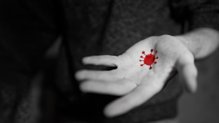 Coronavirus on dirty hands. Virus transfer on the hand of unwashed hands. Black and white photo red...
