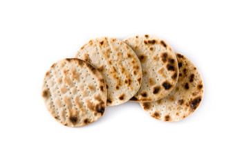 Handmade matzah for Jewish Passover isolated on white background. Top view	