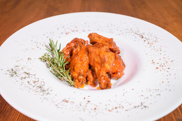 Grilled wings in spicy spicy sauce. Tasty and junk food.