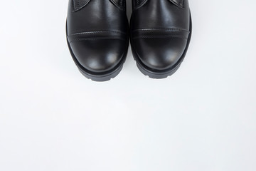 Black leather fashion shoes on white background