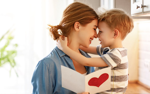 Little Boy Giving Card To Mom.