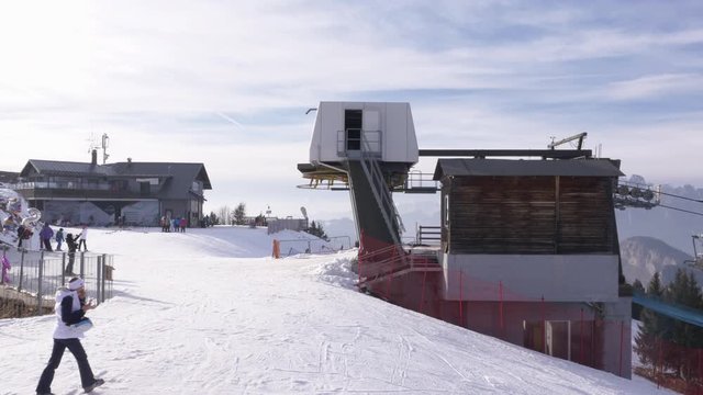 Ski Resort Chairlift Working On Top of Snow Mountain