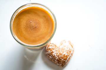 cup of coffee with whipped cream on white background