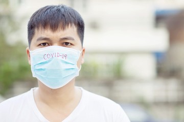 Men wear masks to protect against the Covid virus. 19 and battery