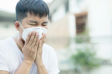 This man was ill with the Covid 19 virus, coughing and sneezing.