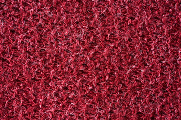 Closeup red texture of woolen knitted fabric. Pattern of red fabric.