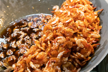 Sweet Shrimp in big pan at Amphawa Floating Market, Thai street food