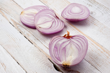Red onion, lettuce. Health benefits, very rich in vitamins. Background for vegetables and garden plants and cooking.