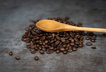 Coffee beans with wooden spoon