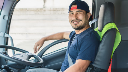 Happy smiling of professional truck driver asian man in a long transportation and delivery © Nuad Contributor