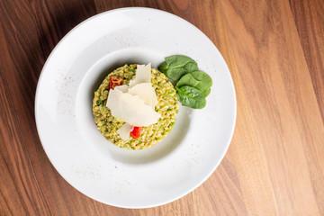 close up of tasty green italian risotto with parmesan