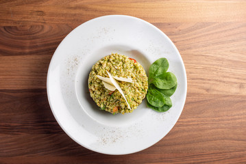 close up of tasty green italian risotto with parmesan