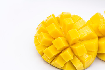 Yellow  mango slice with cubes isolated white background