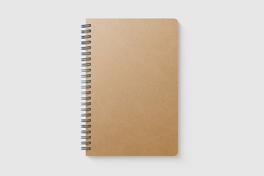 Real photo, blank spiral bound notebook mockup template with Kraft Paper cover, isolated on light grey background. High resolution.