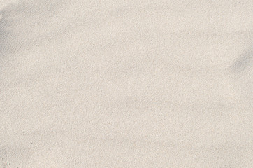 Fototapeta na wymiar White sand texture and background. Sand on the the beach as background