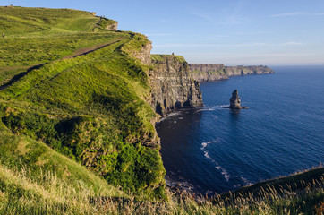 Bright green and blue Cliffs of Moher path