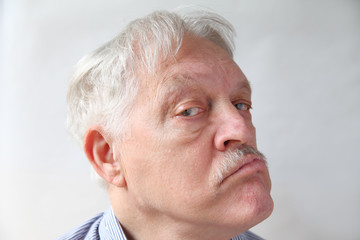 Senior man with doubting expression