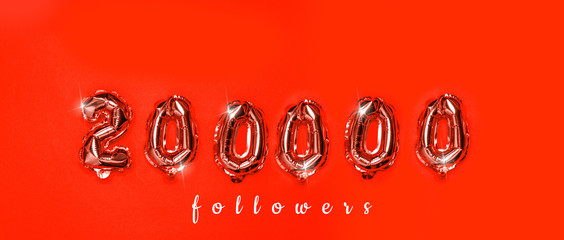 200,000 numbers foil balloons on horizontal red background. Followers concept