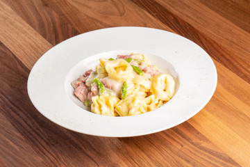details of fresh hot tortellini with meat and sauce