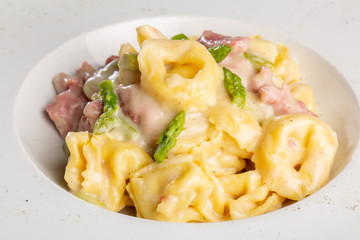details of fresh hot tortellini with meat and sauce