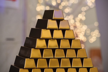 Gold ingots stacked in pyramid