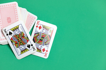 playing cards on the green poker table.  Gambling. Addiction. Bets