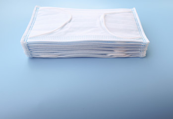 Clean face Masks  isolated on light blue blackground   against  protection infection  safe from coronavirus COVID-19 prevention of the spread of virus and pandemic