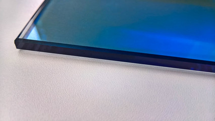 blue glass. a fragment lies on a table