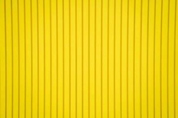 Abstract pattern of  yellow background with straight lines textured. wooden material room wallpaper interior decorative, modern style, copy space.
