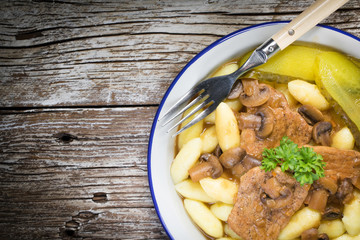 Braised pork loin with mushrooms.